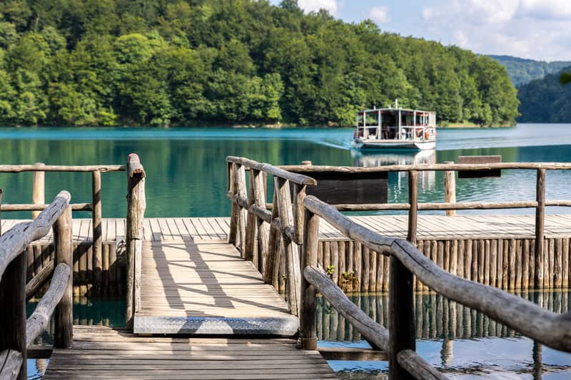 A boat crossing a lake in the Plitvice Lakes National Park